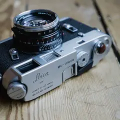 A classic Leica M4 camera with a Summicron 35mm lens, ready for capturing timeless moments.