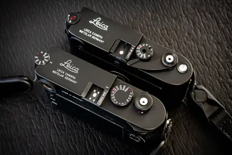 Two black Leica M cameras, ready for detailed Leica lenses reviews.