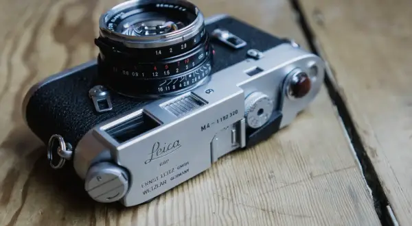 A classic Leica M4 camera with a Summicron 35mm lens, ready for capturing timeless moments.