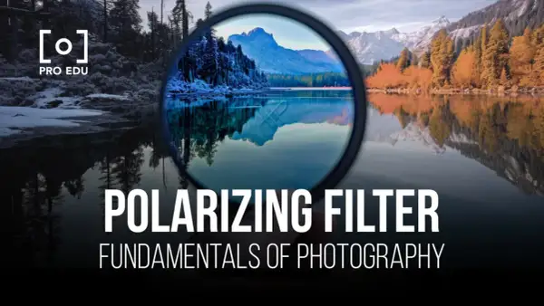 A polarizing filter enhances a landscape photo, reducing glare and deepening colors. The image shows a lake reflecting mountains and trees, with the filter in the foreground.